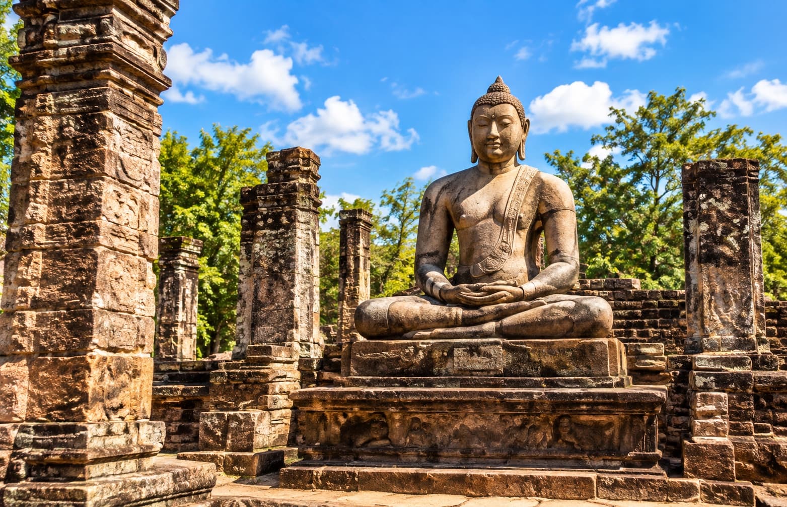 A seated Buddha among Sri Lanka's ancient stone ruins